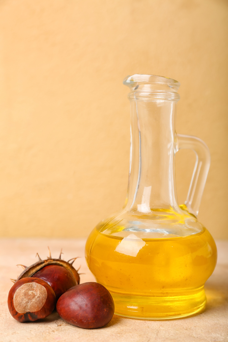 Decanter with Chestnut Essential Oil on Table